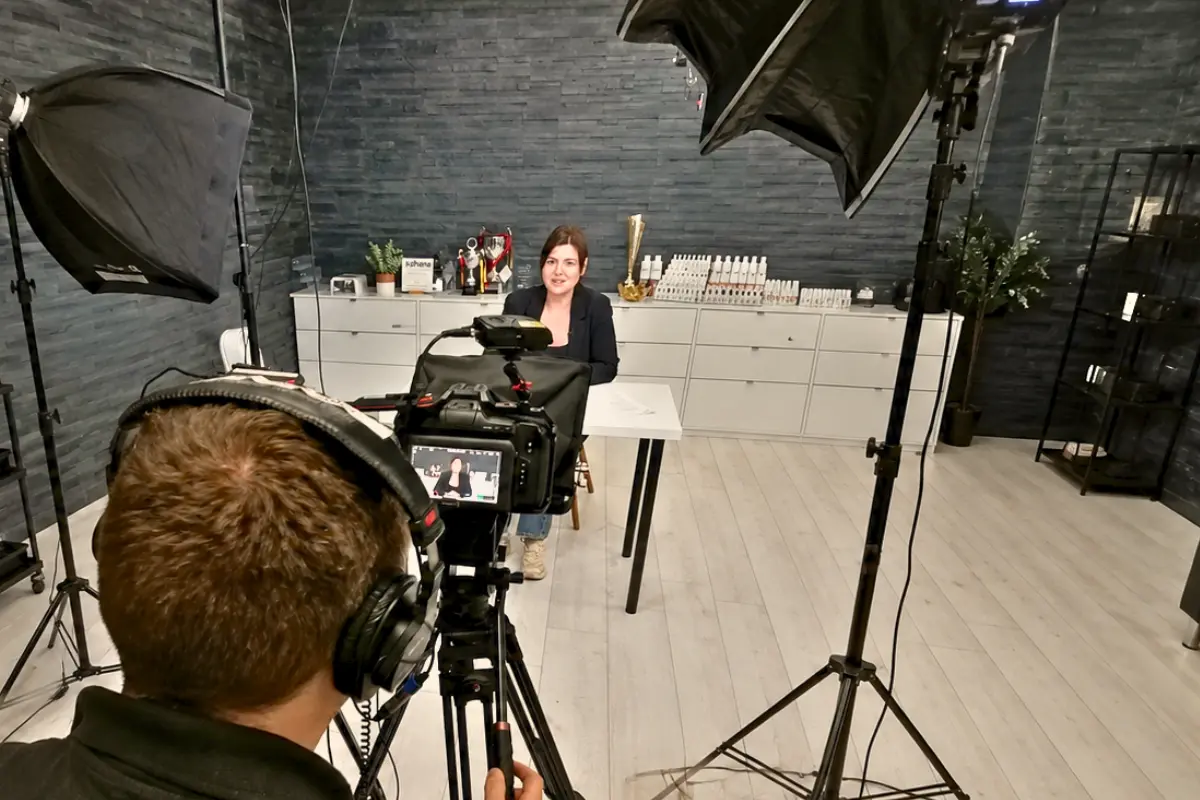 Tutorial video production of a nail salon owner explaining how to apply acrylic