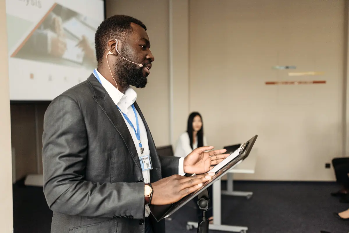 Presenter engaging in two-way communication at a hybrid event live streaming conference
