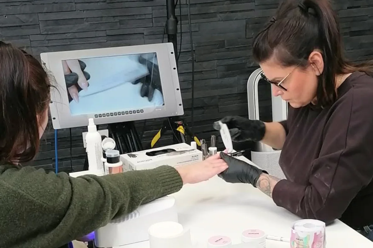 Behind the scenes of a tutorial video production Ireland shoot for a beauty and nail technician training walkthrough